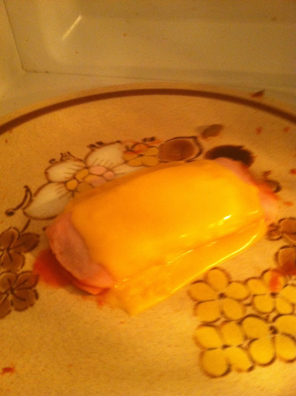 It is ready when the cheese on top is some what melted. Let cool for a little while. Not too long though. Maybe the amount of time it takes to put your supplies away.