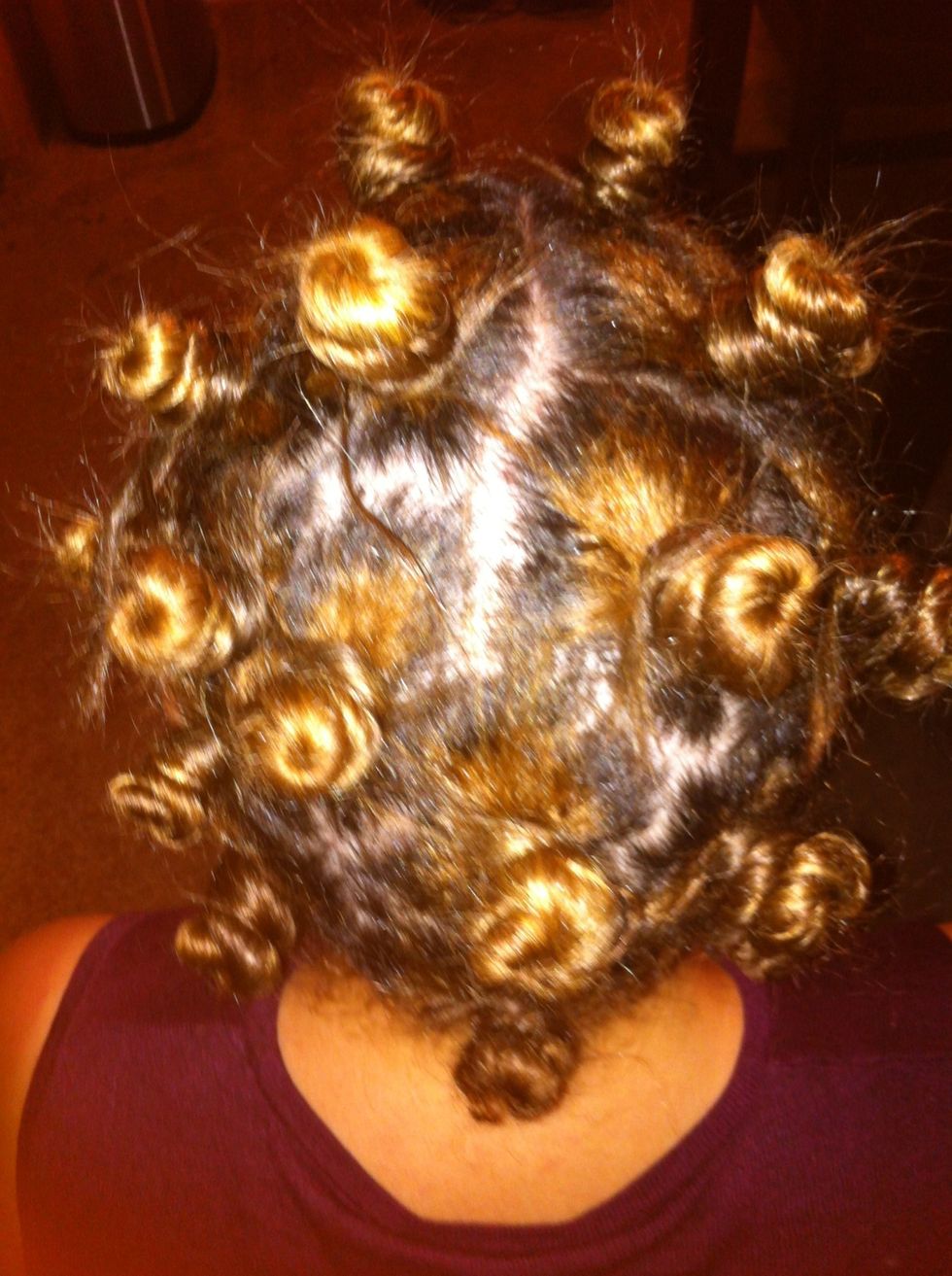 It looks more natural if you don't section the hair into straight parts.