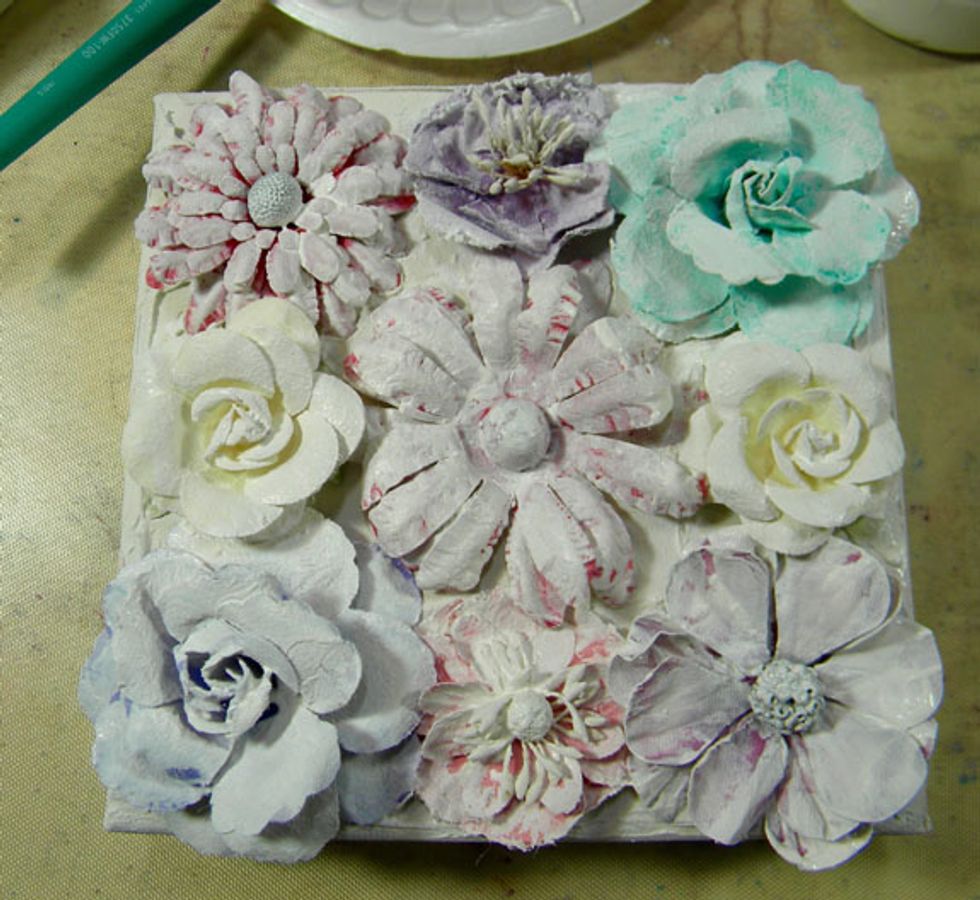 It may take a few coats of gesso to cover the flowers.  I also painted gesso on the petals underneath.  Let dry completely