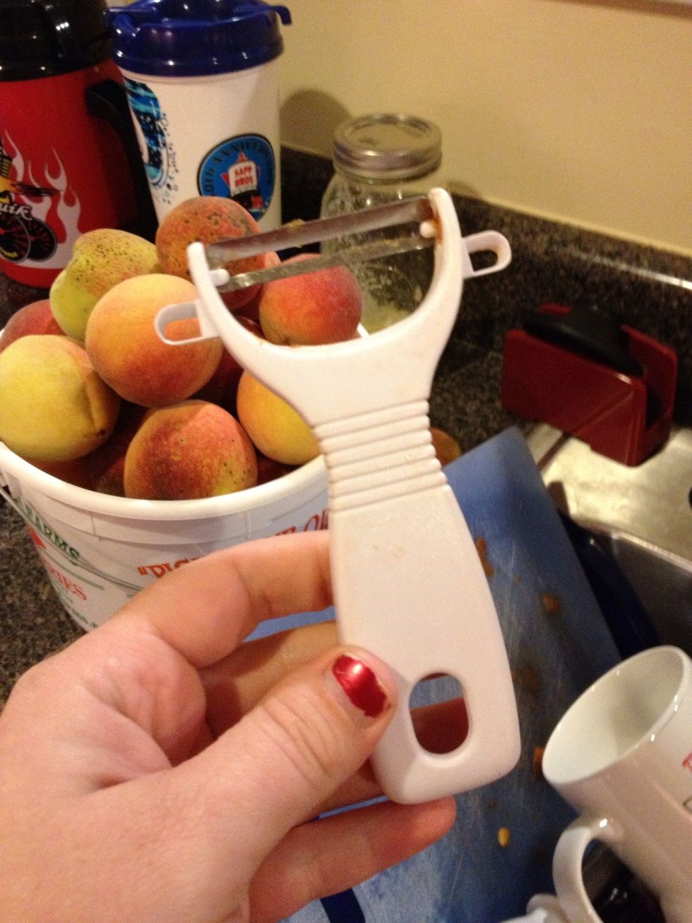 It might not be popular, but I find that you can't beat the humble vegetable peeler. You do not want to spend hours blanching and peeling 5 lbs of peaches. Trust me on this.
