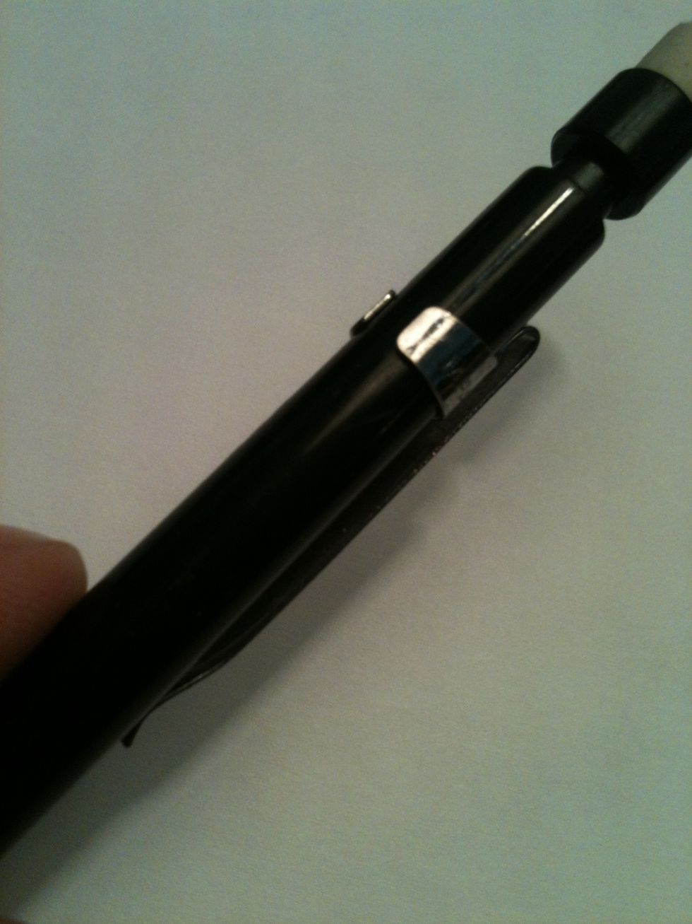 It must have a metal clip that can slide up and down the pencil.