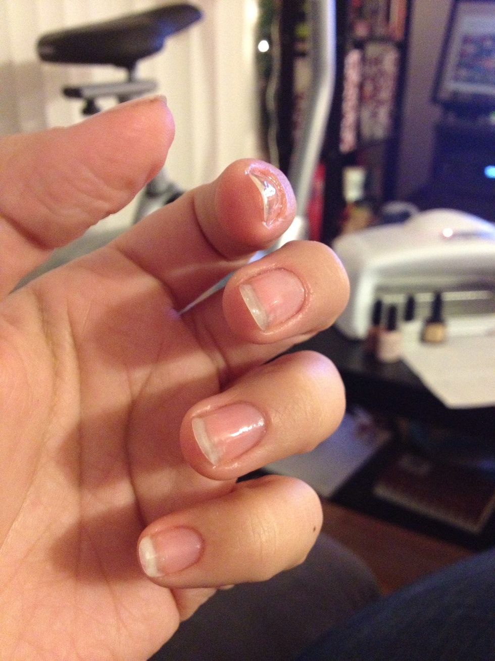 It paints on clear. Don't glob it on. The thinner the better. Do underneath the nail and the rim. If you get some on your skin or cuticle, just use your fingernail or cuticle pusher to wipe away