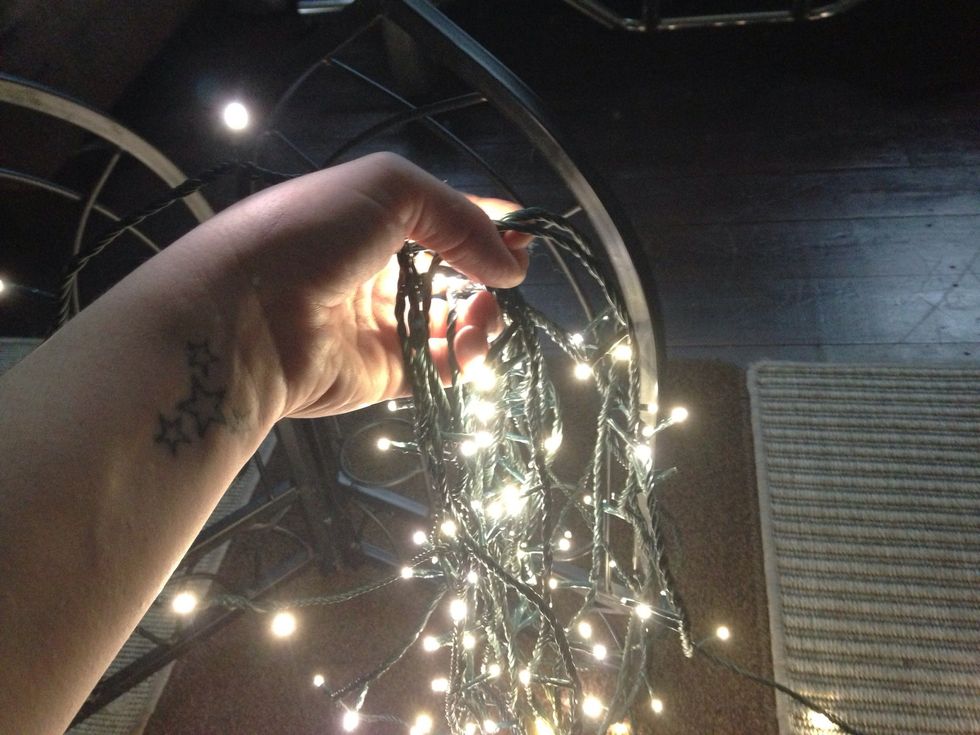 It's a tedious job but I wound the lights around the frame. You can fasten the light on with thread, wire or cable ties too, my lights were really long so it was a way of using up the length.