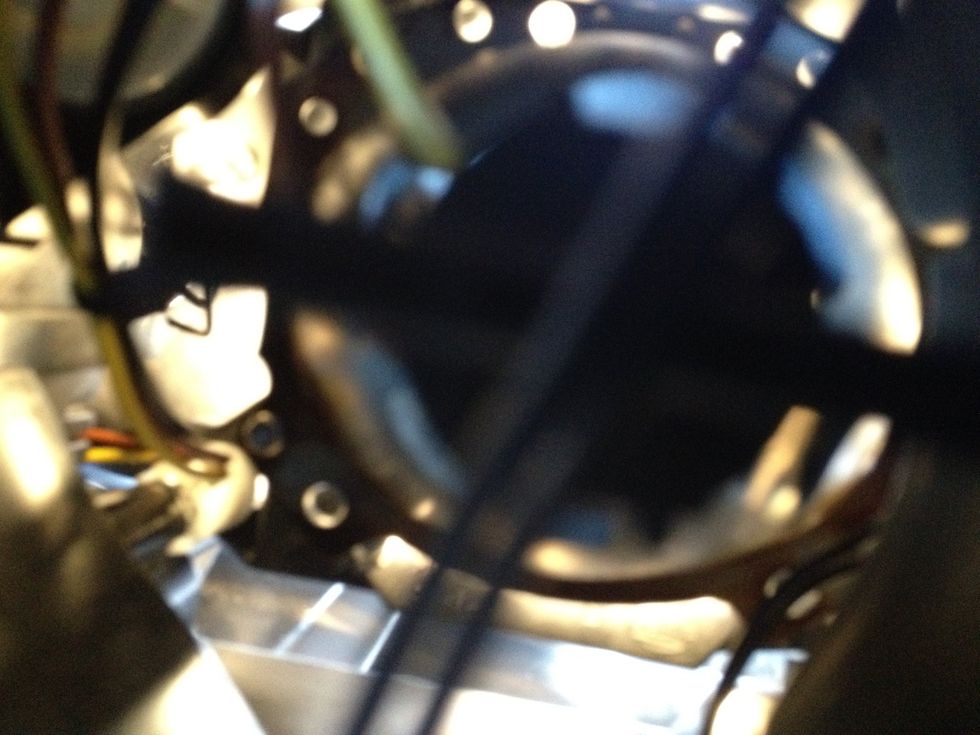 It's a terrible shot, but the socket is back in securely. Its a tight spot and other parts of the car were hot! Reinstall the dust cover.