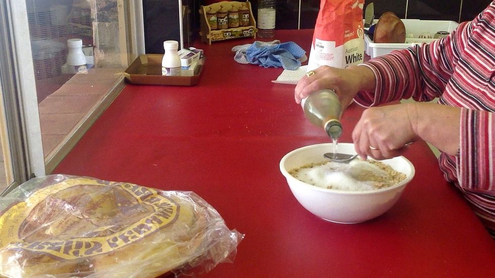 It's about 1/2 cup, 1 tablespoon at a time, of orange blossom water. However, you can judge yourself by the consistency. We need enough to bring the nuts together but not drown them.