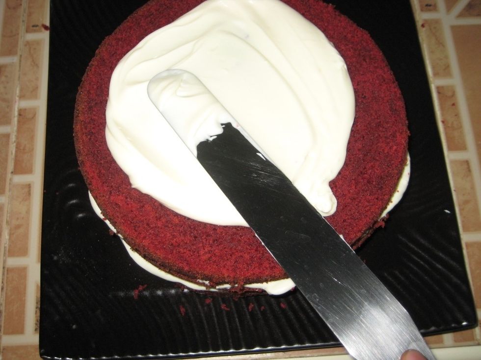 It's about moving the pallets knife from left to right while turning the cake as well. The frosting on the inside should not be much as you need more to completely cover the cake.