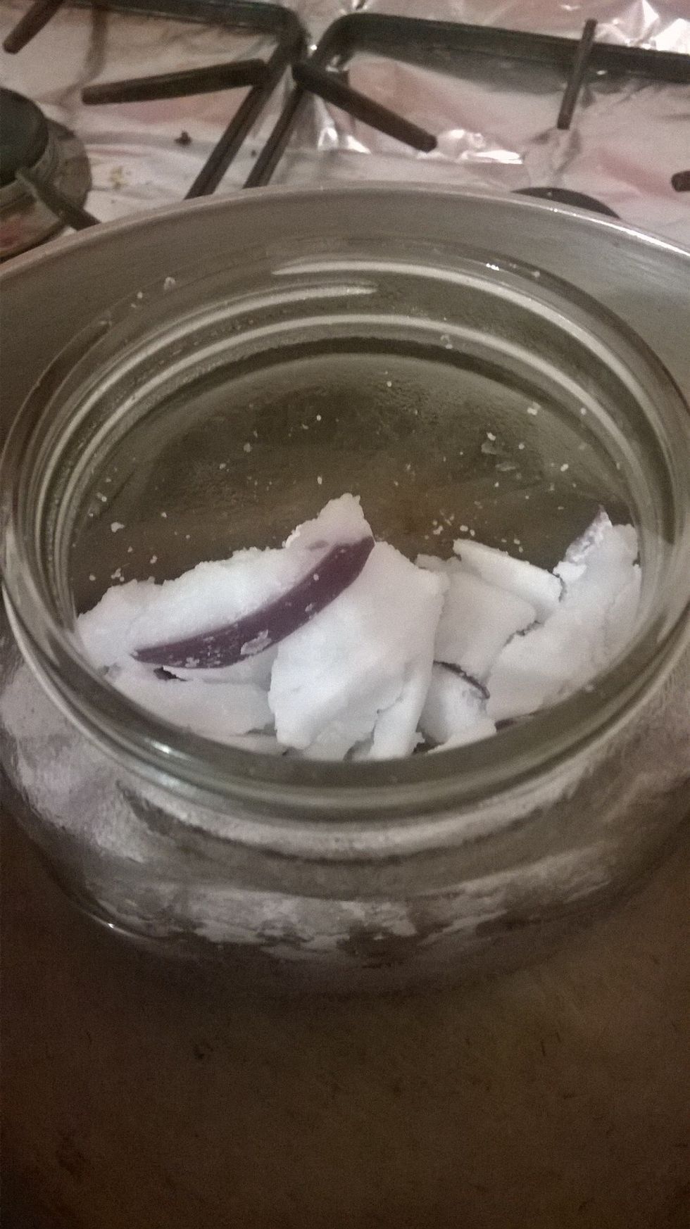 It's already starting to reduce. Don't be afraid to turn the heat down if you feel a bit worried about it. You can slowly start to add more bits of wax in.