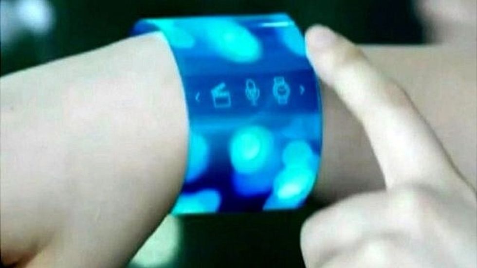 It's also semi transparent. So because electronics can be made so small, flexible and transparent. This image is likely possible in the near future. Imagine carrying a PC on your wrist or in a wallet.
