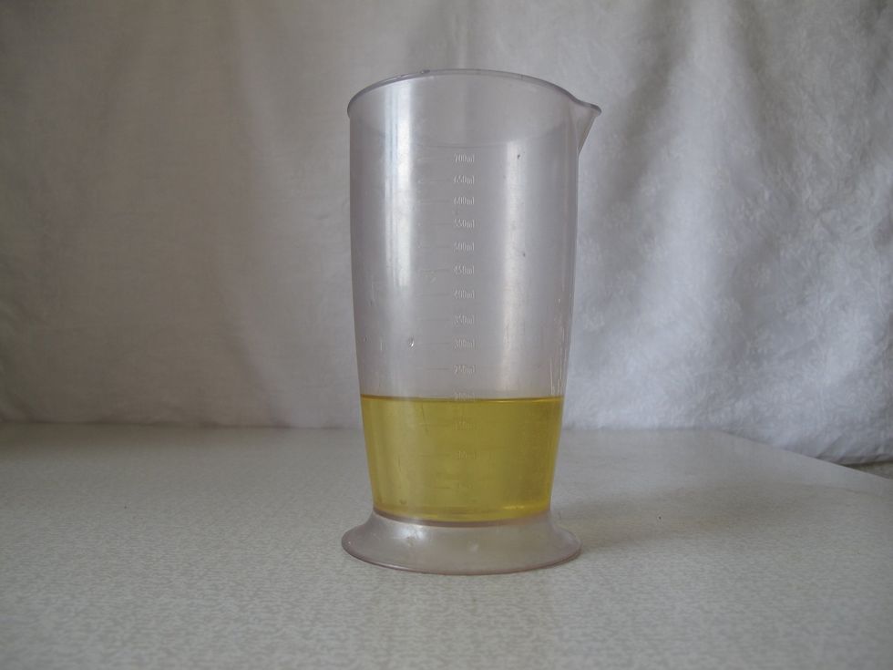 It's better to use oil without any flavors, but it's your own choice. I prefer to mix 180 ml sunflower oil with 20 ml olive oil.