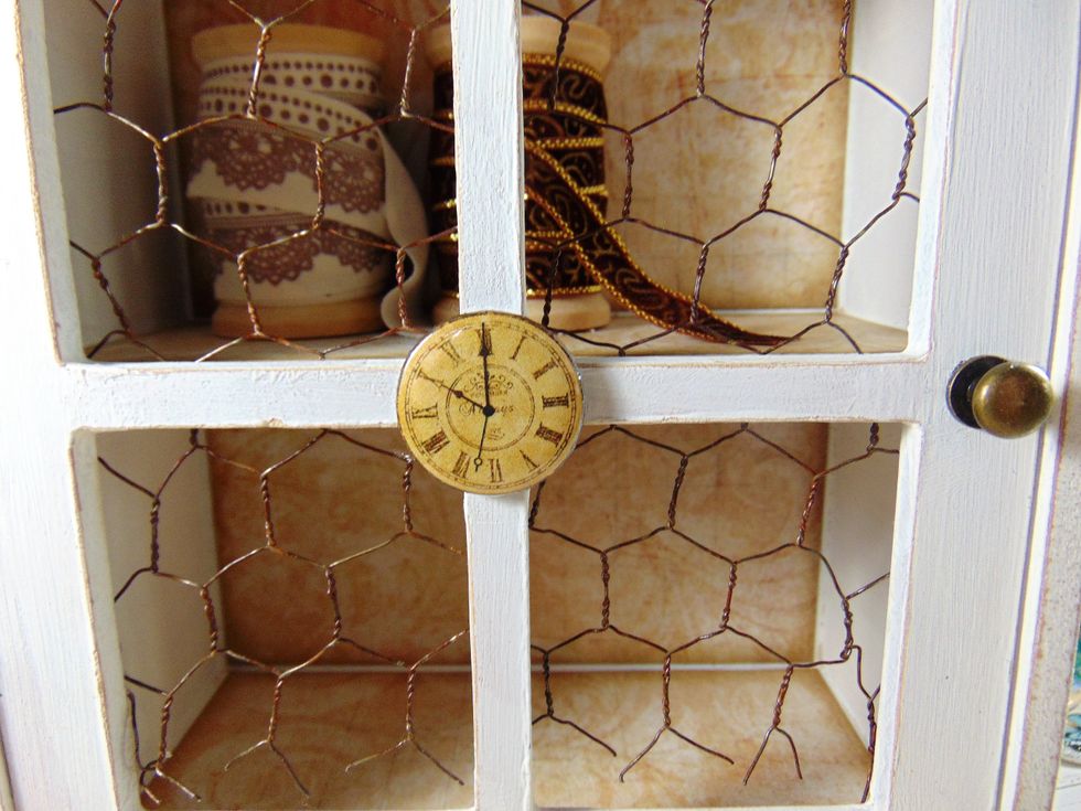 It's embellishments time! All of these came from the January main kit, the project kit and the embellishment/ flower add on's. Glue the clock badge to the middle front.