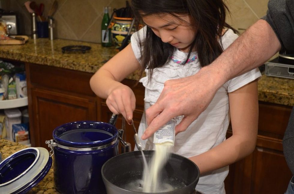 It's fun to dump stuff in water. Plain gelatin and sugar go in.