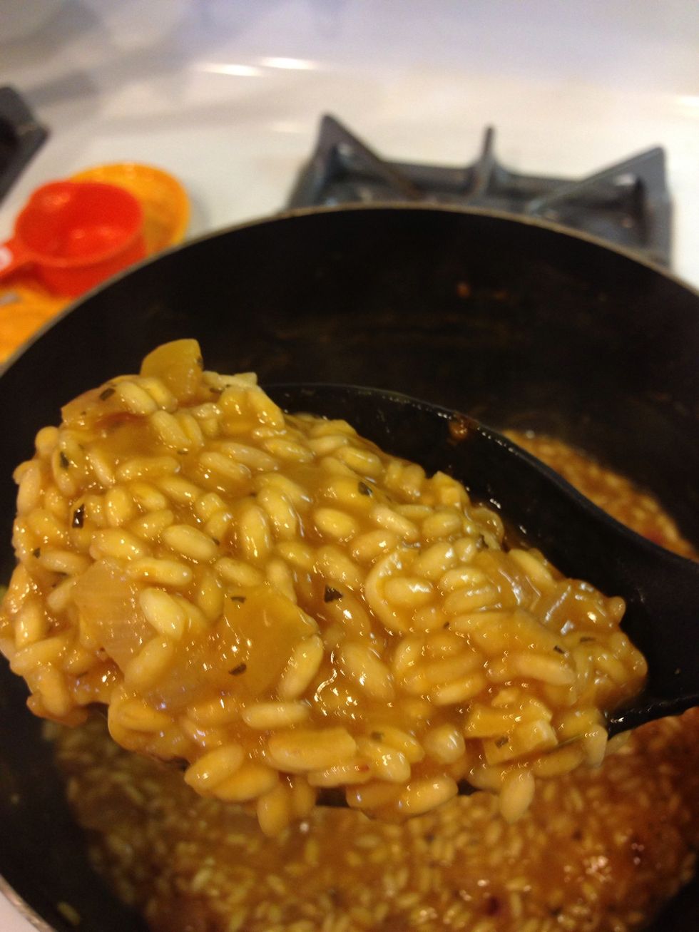 It's getting there! Start test tasting to see if the rice is as done as you want it!