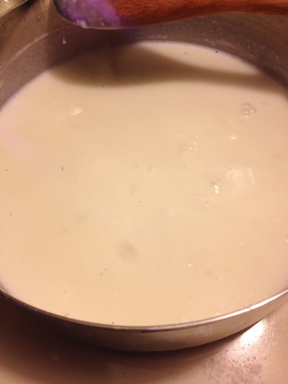 It's hard to see here, but allow the roux to bubble gently, stirring occasionally, for a minute or two until it is beginning to thicken