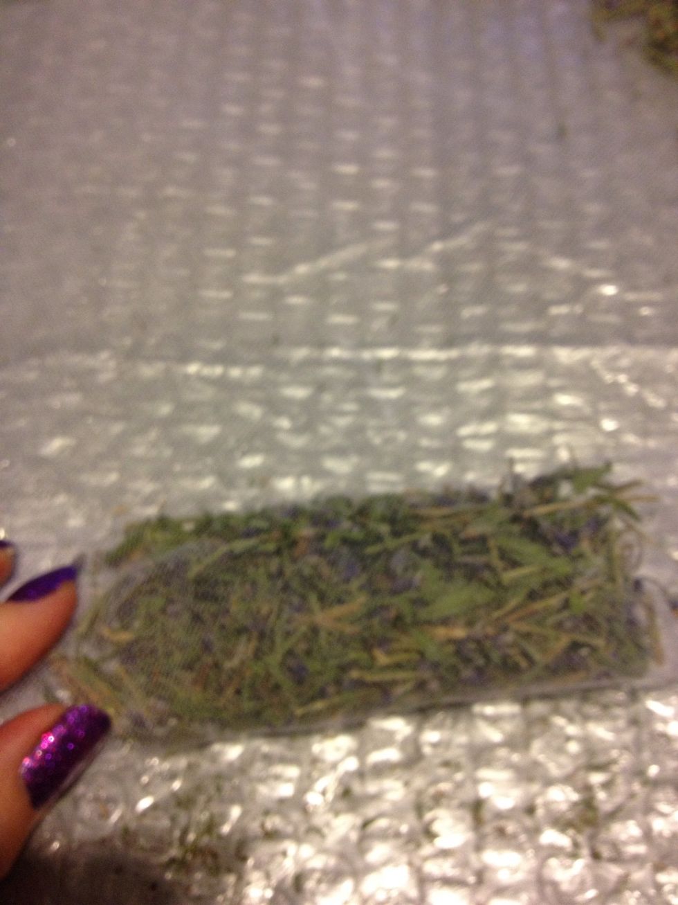 It's ideal to place the the lavender in the middle and gather the ends up but I found some pieces would fall through the tulle. Place a bunch of lavender near one end and roll it up a couple times.