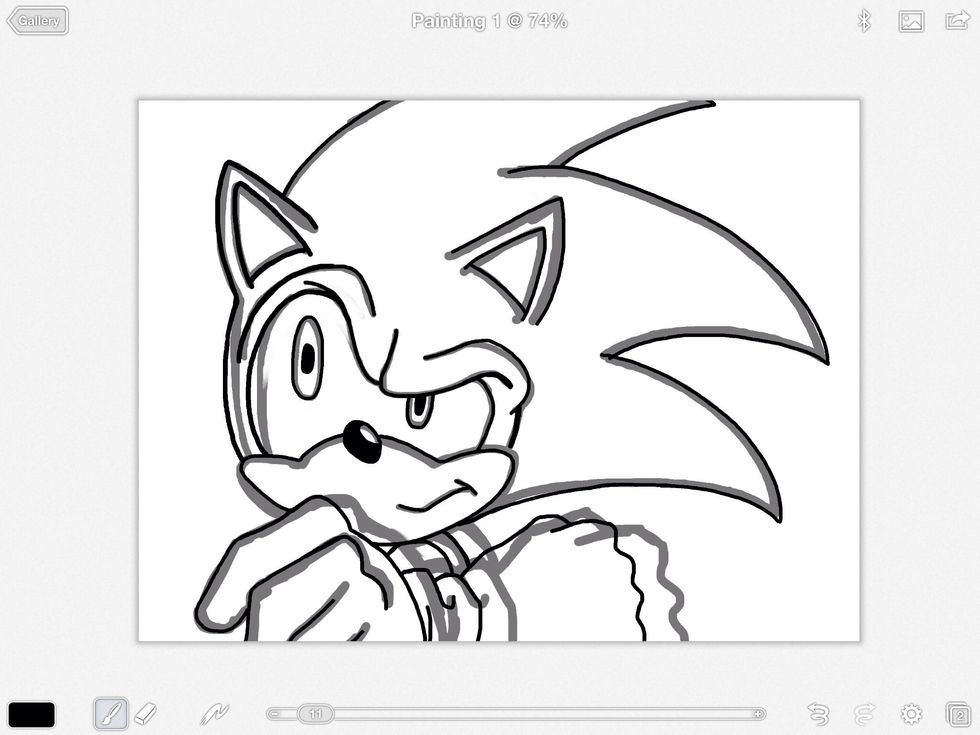It's important that I compare my work to the photo. The ink layer is what comes before color and it has to be right. As you can see here the hands are a little big so I needed to rework them.