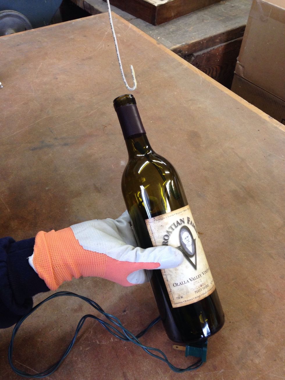 It's nice to have 1 light up the neck of the bottle. Use a bent coat hanger wire to gently pull up 1 light.