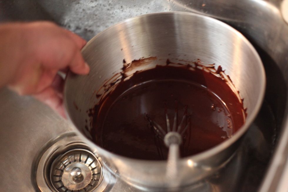 It's ok to keep whisking while cooling down. Touch the stainless steel around the side and it should be cold enough to pick up without a towel. See the bubbles disappearing?