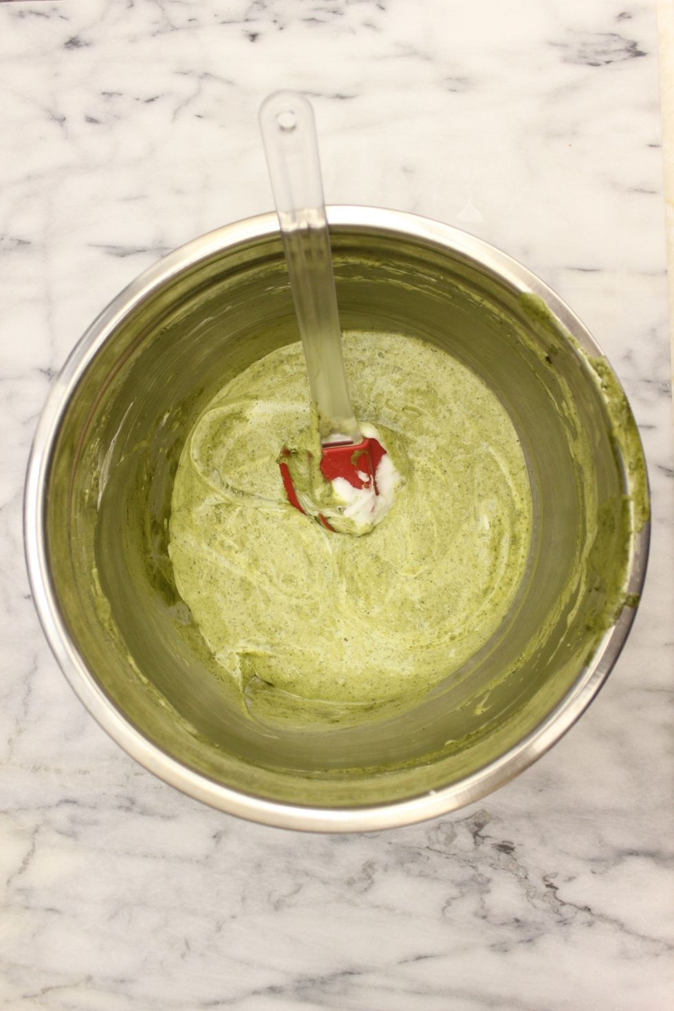 It's okay to have some streaks. There are no leavening agents in this recipe so you want to keep as much air in the batter as possible throughout your batter prep.