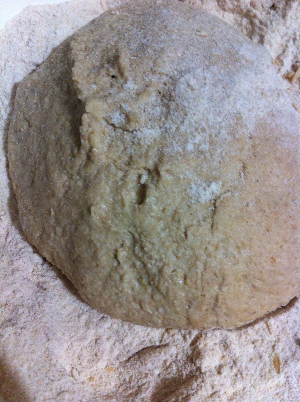 It's risen after few hours. Knead it by sprinkling dry flour. Knead it for few minutes until it stops sticking and shape it into a ball