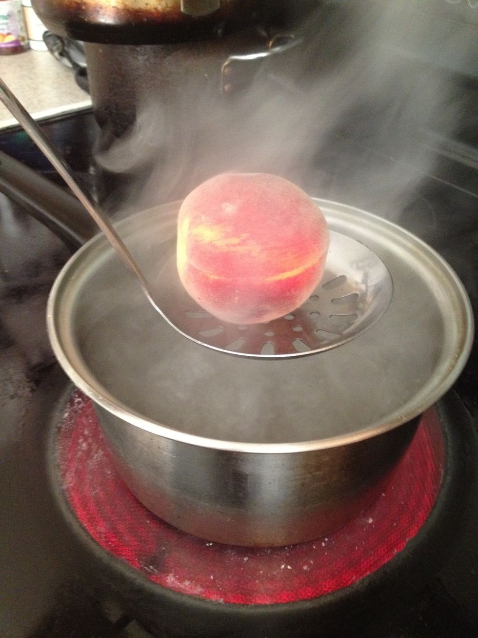 It's so easy to peel peaches. Boil water and use a slotted spoon to dunk them in for around 35 seconds... Then...