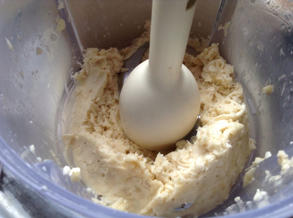 It's starting to get smoother! Keep scraping down the sides and pulsing. You might need to take the blade out and scrape that too.