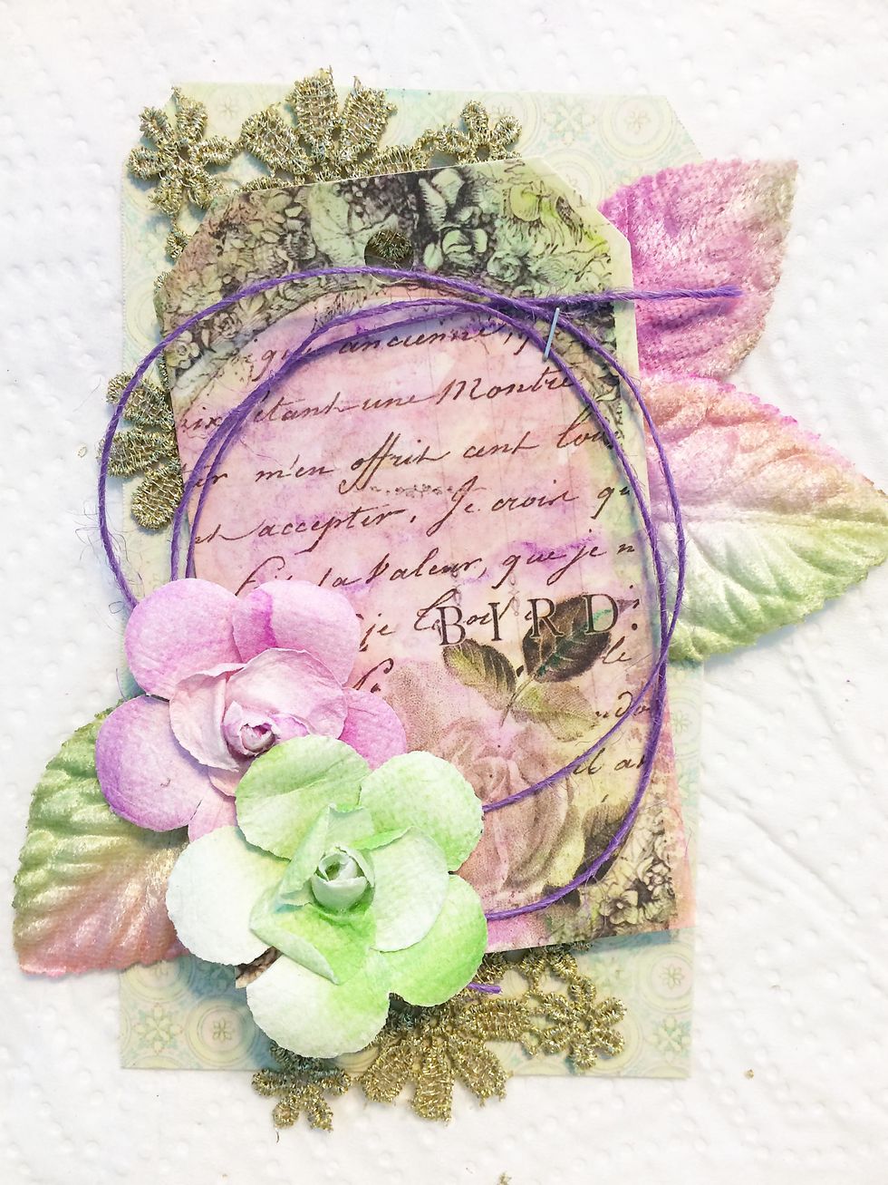 It's time to embellish! Add three leaves and two flowers as shown.