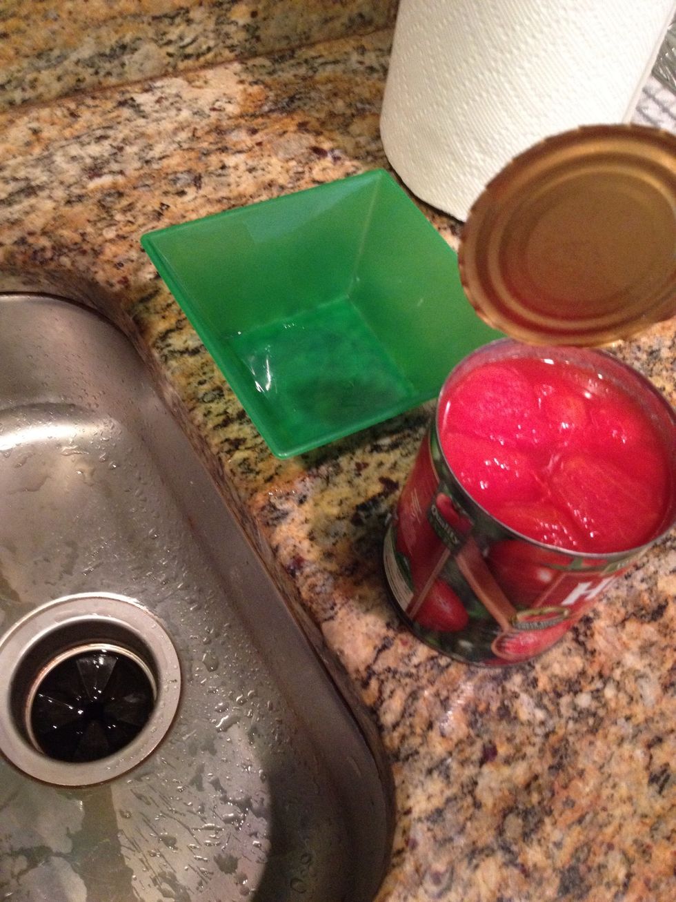 it's tomato time! crack open that can and move over to the sink. you will need a small bowl and an apron if you've got it - the tomato goop tends to have a mind of its own!