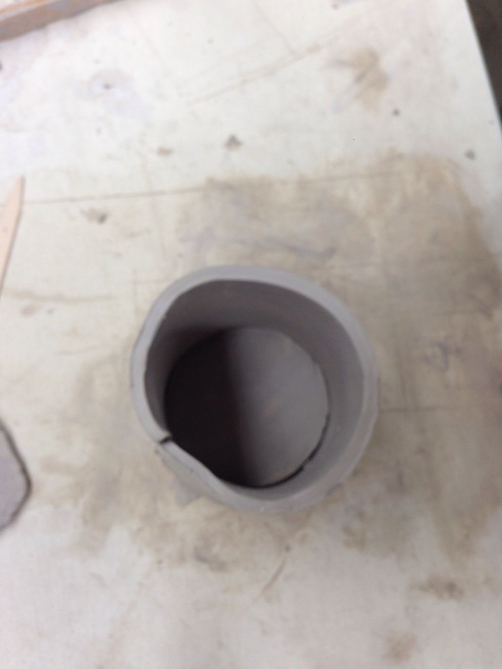 It should fit snugly to the edges of the base.