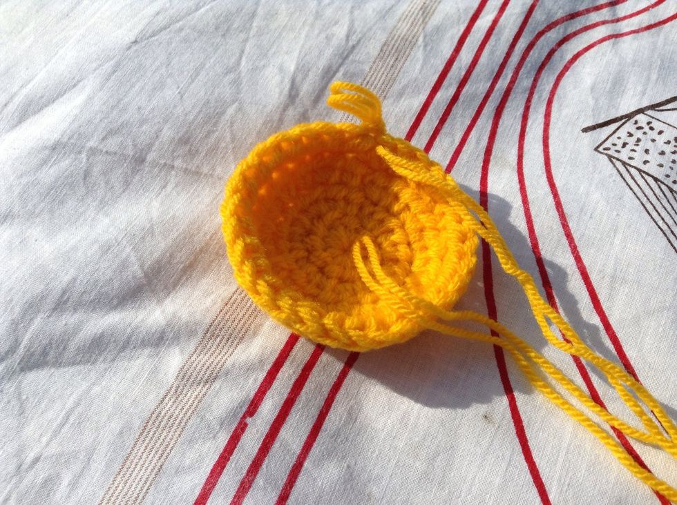 It should have a bowl shape now. Continue working on the right side, the beginning yarn tail should be on the inside (wrong side). You can weave it in now or wait til the end.