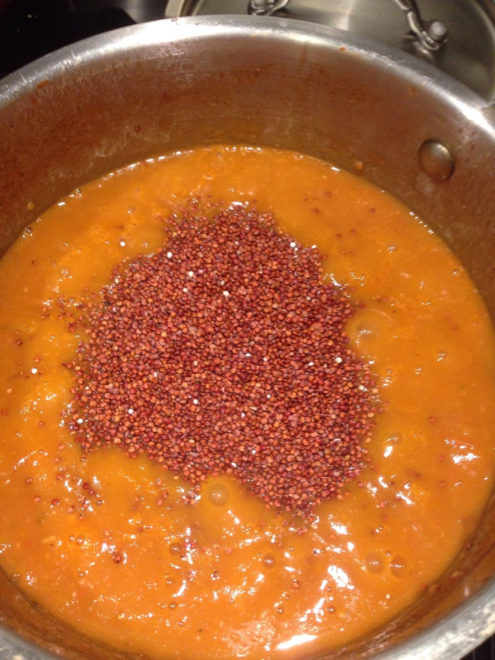 It should have a nice red orange colour now, add the quinoa