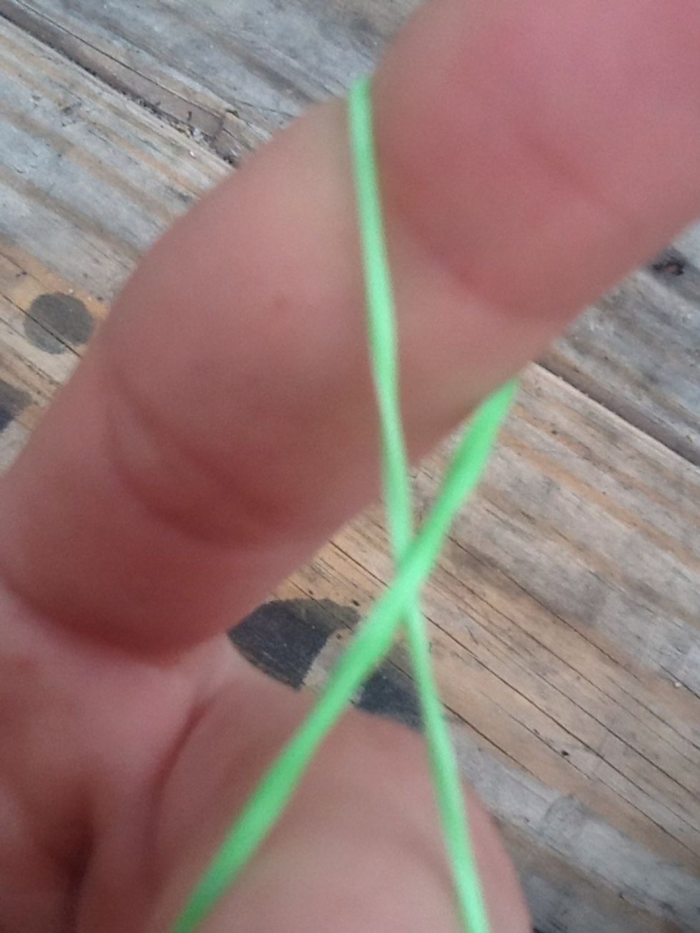 It should look like a 'X' in between your fingers or an 8 whatever you want to call it