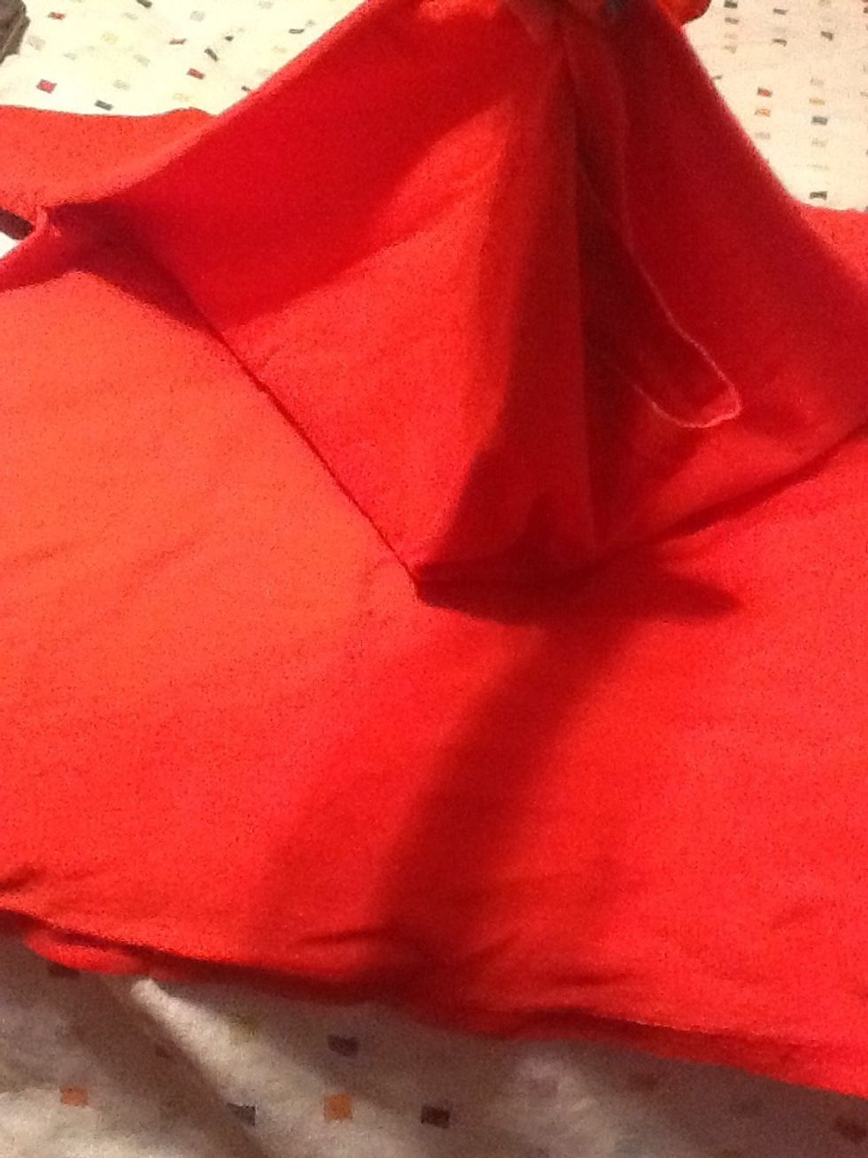 It should look like this once both sides are cut. Make sure you do not separate the front and back of the shirt.