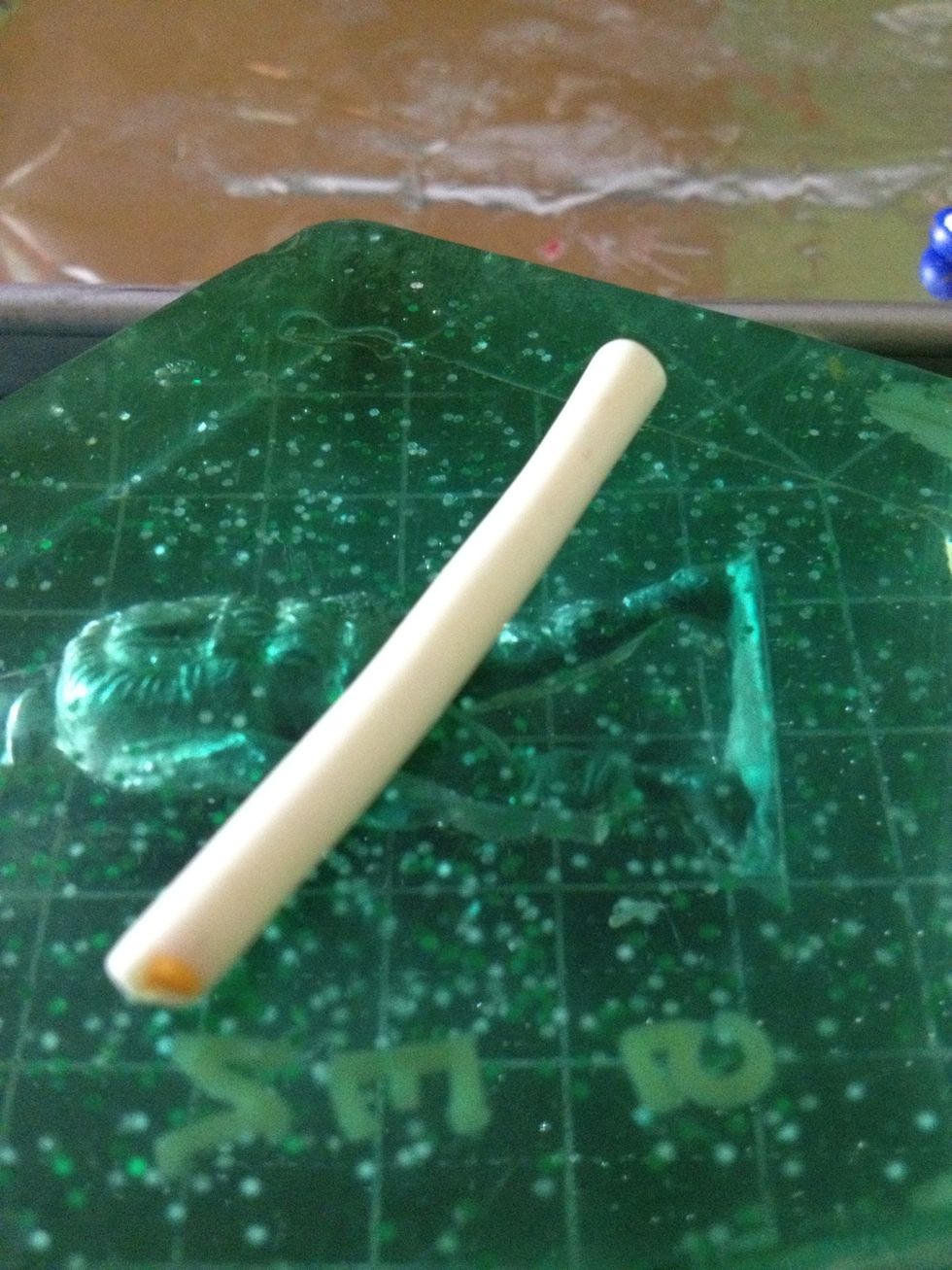 It should look like this. Then slice a small piece. This is going to be the 'half hard-boiled egg'.