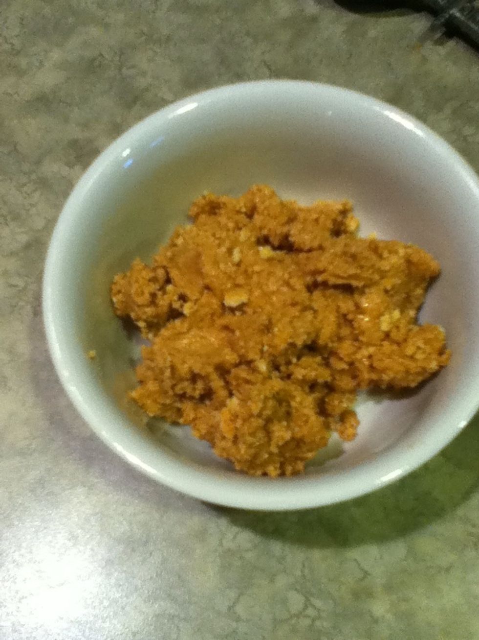 It should look like this up to this point. Place the mixture in your serving dish and place plastic wrap over it. Press down on the plastic wrap to tightly pack the graham cracker crust.