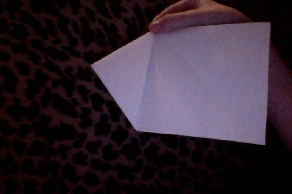 It should look like this. You will now unfold the paper.