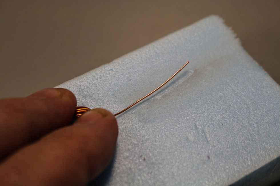 It should look shinier on the side you sand off the coating.