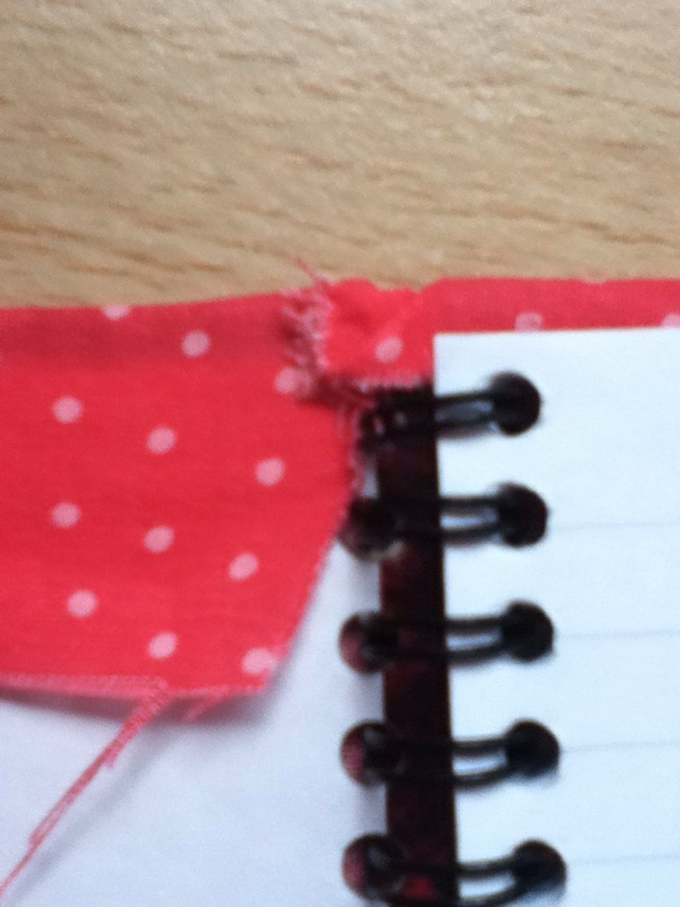 It should look similar to the picture above. Repeat with the opposite end of the notebook.