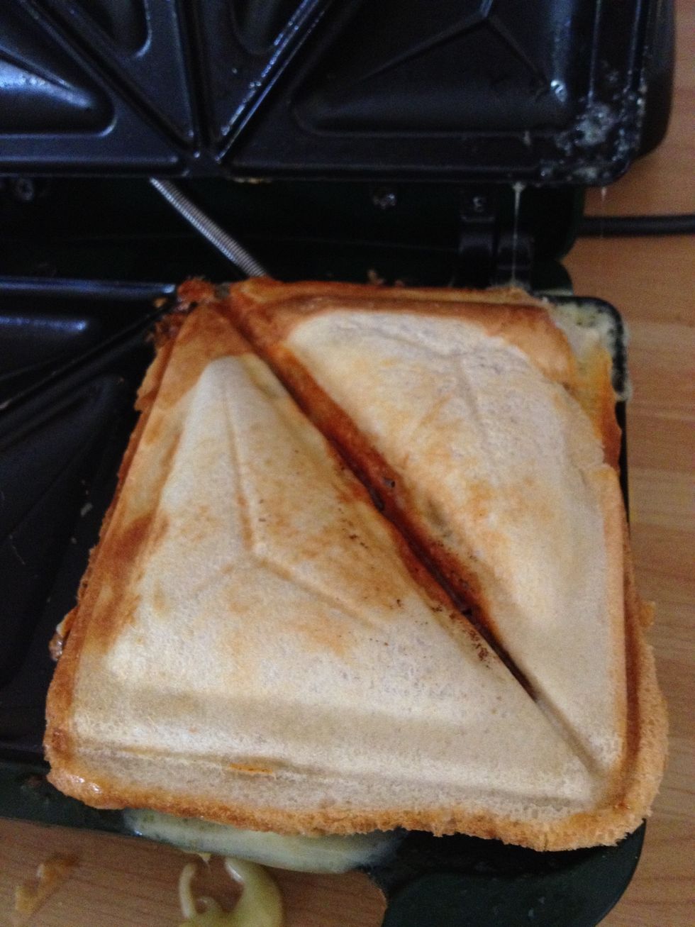 It should look something like this after 3 minutes in the toaster. Two pillow cases of melted cheese and a nice sauce over some sausages.