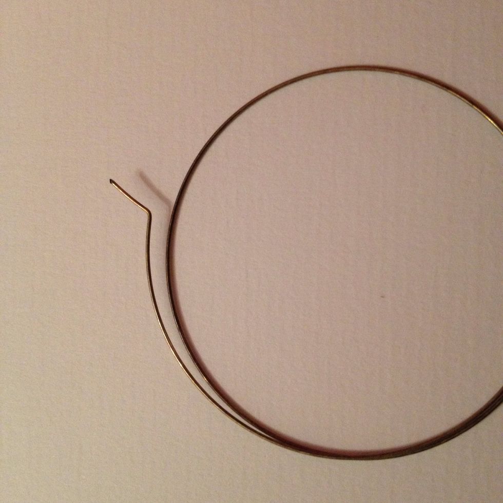 It should look something like this, slightly wider than a right-angle.