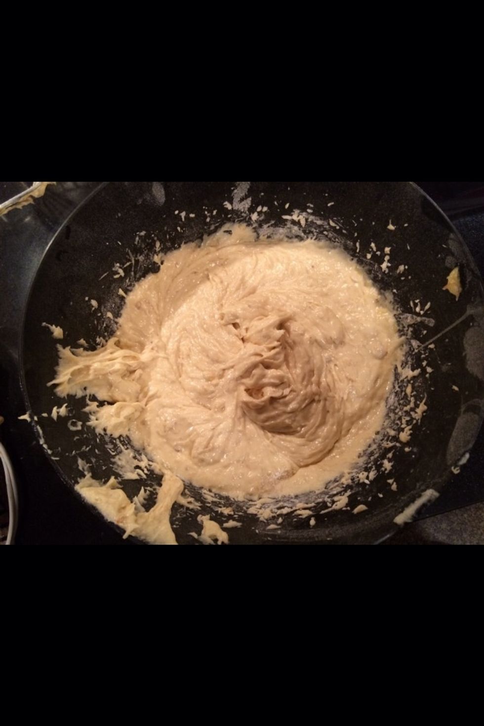 It should look thick and doughy. Keep stirring if you see ingredients