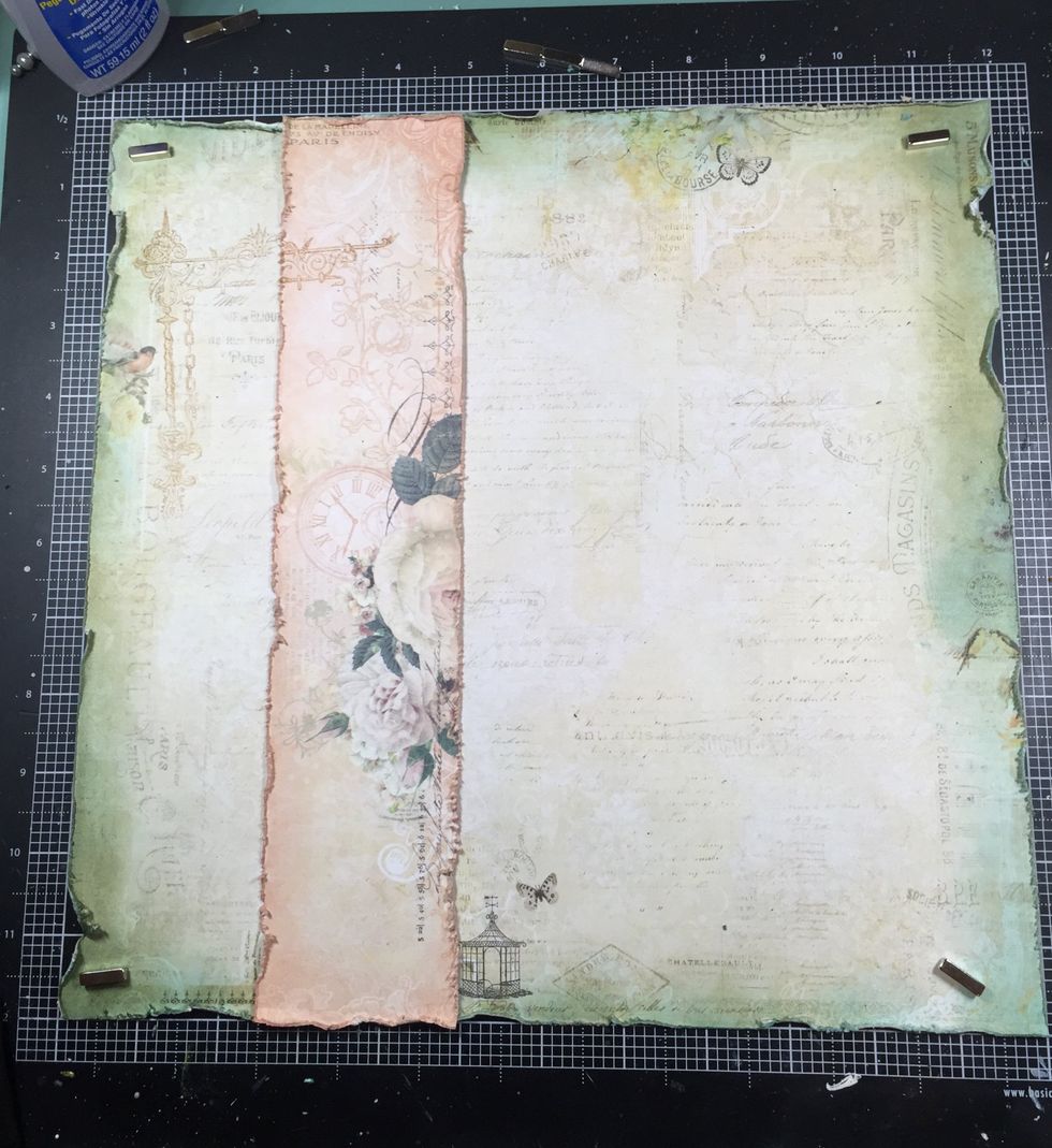 It\u2019s time to start gluing down my layers. I used a corner stamp (Blue Fern Studios) over these layers.