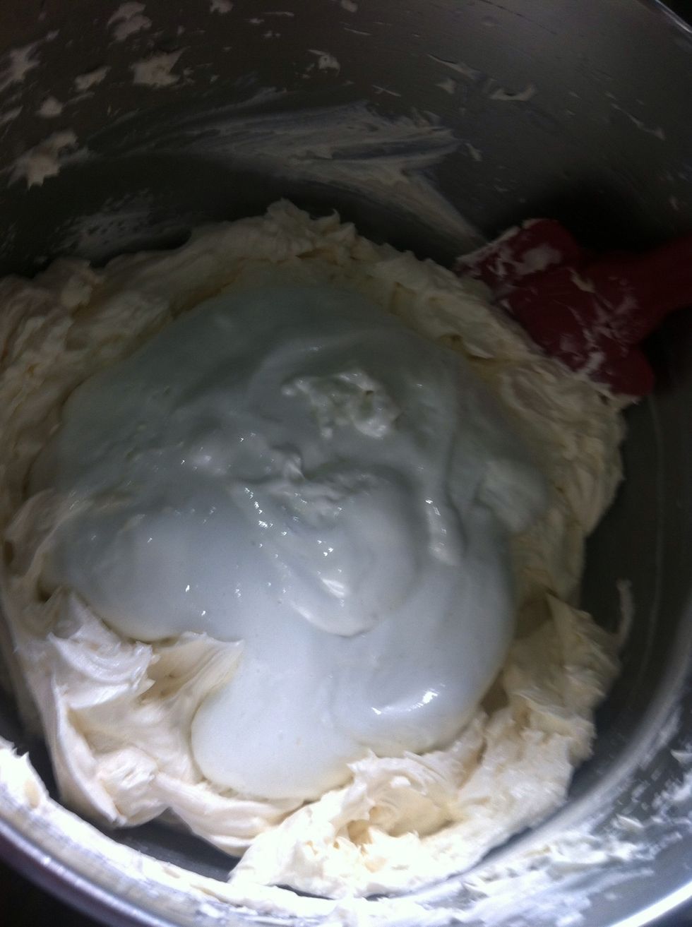 It will be like this!:) once you pour it gently fold the buttercream into the marshmallow cream using spatula once you have covered the marshmallow cream put it in the mixer on medium high.
