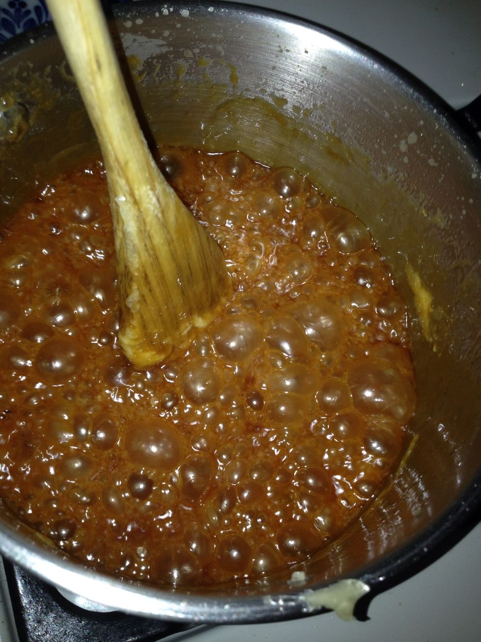 It will break into bubbles and may splatter so be careful. And keep stirring!