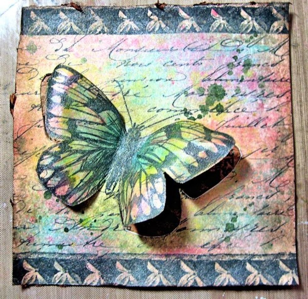 It will look like this.  Keep lifting and shaping the wings.  This paper will keep its shape once it is heat set. It's pretty amazing!