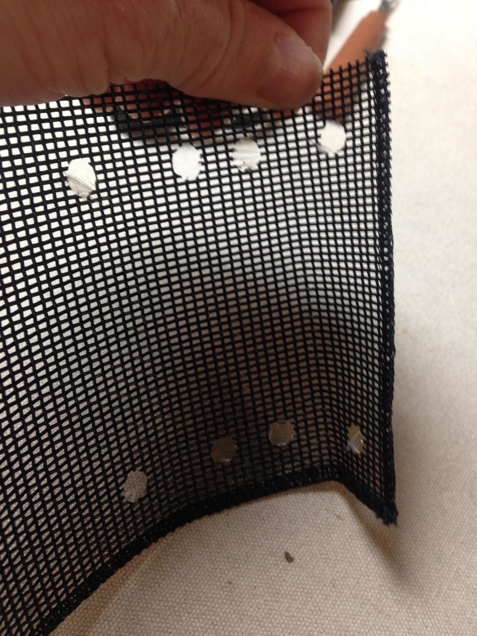 It will look like this when it is opened.  Then fold the opposite side over to the first two holes and repeat the hole punch process.