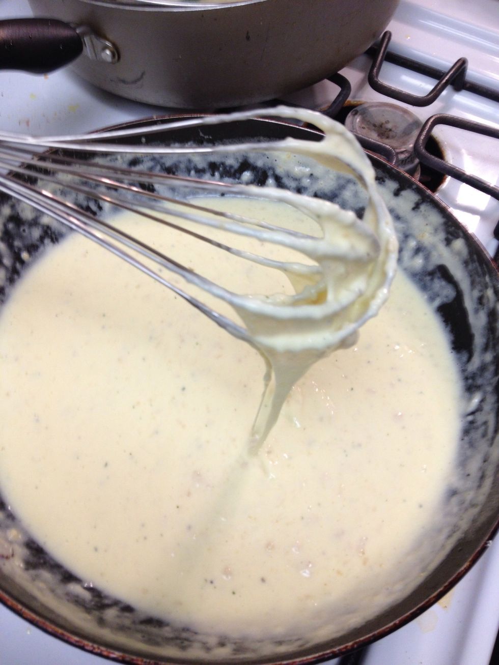 It will start to look cheesy. If the consistency is too thick for you (as a it was for me) add in milk 1 teaspoon at a time, until you have reached your desired consistency.