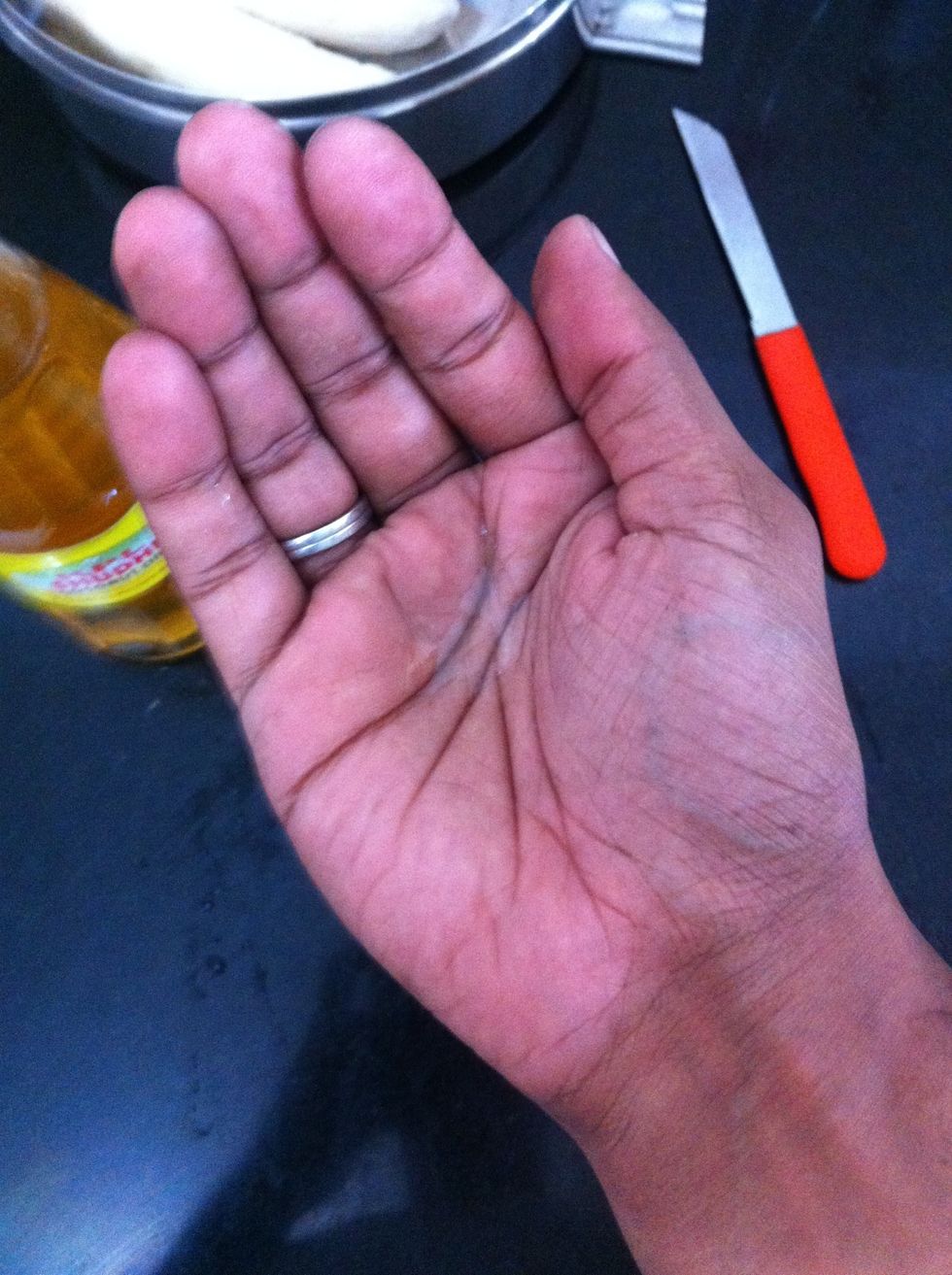 It would be good if you apply some oil on your hand, plantains discharge a gluey serum that is both hard to get off the skin and also gets between your nails.