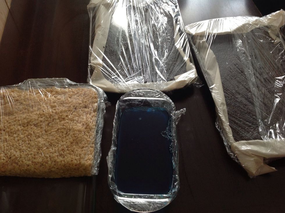 Jello in a bread pan lined with Saran Wrap, one recipe of chocolate cake divided in two cookie sheet pans and double recipe of Rice Krispies