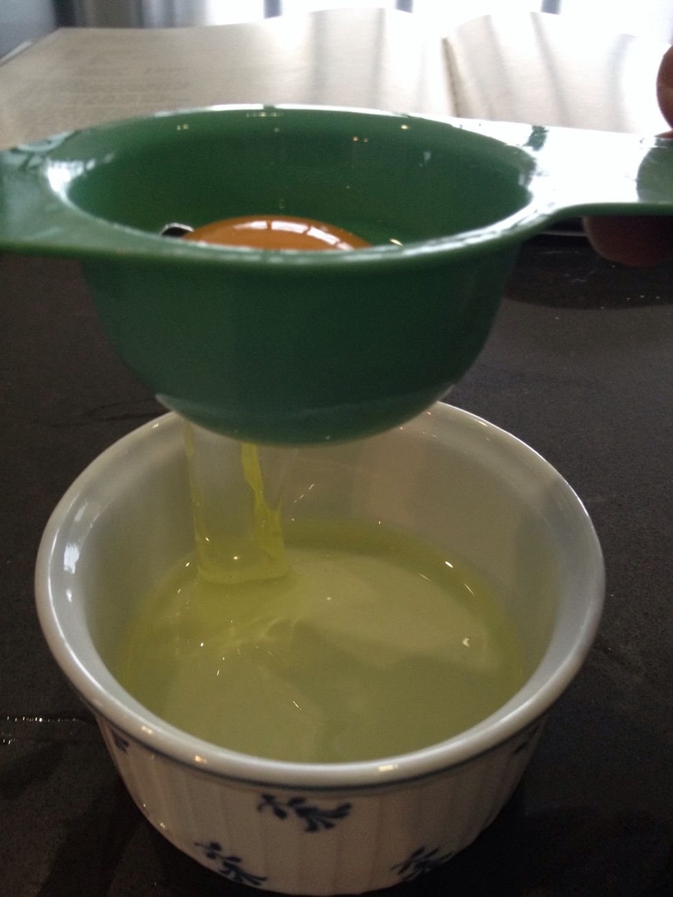 Jiggle it so the white falls through into a small bowl. (Strain method done)