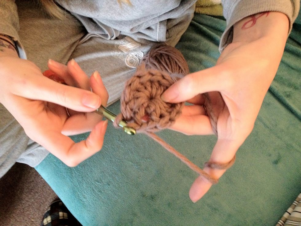 Join with a slst in the third stitch of your beginning chain. This completes the first round of your hat!
